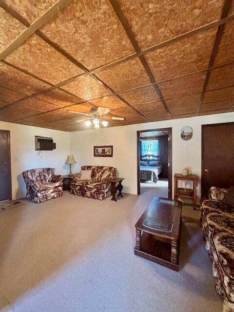 carpeted living room with ceiling fan