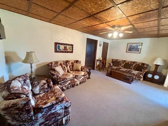 carpeted living room with ceiling fan