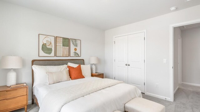 carpeted bedroom with a closet