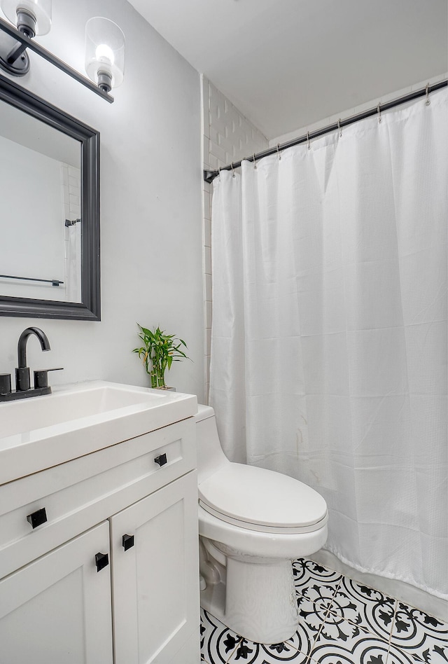 bathroom with vanity and toilet