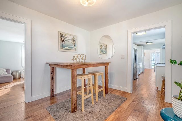 dining room with light hardwood / wood-style floors