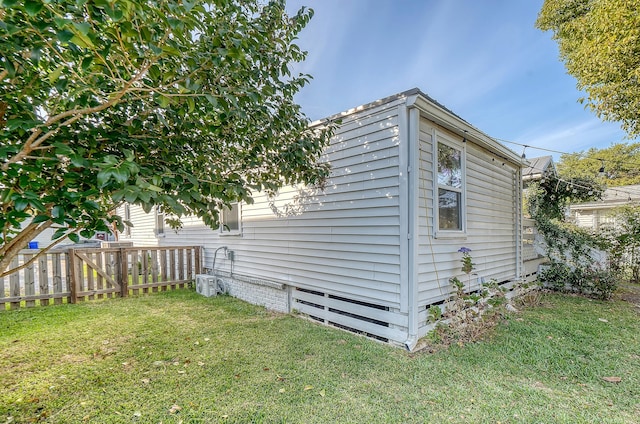 view of property exterior with a yard