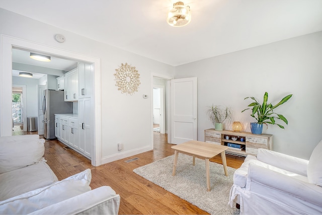 living room with light hardwood / wood-style floors