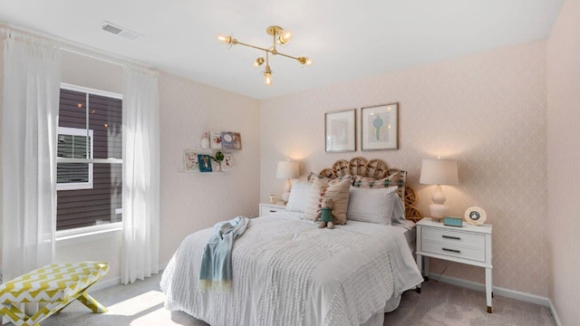 bedroom with wallpapered walls, baseboards, visible vents, light colored carpet, and a notable chandelier