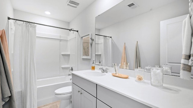 full bathroom featuring toilet, visible vents, shower / tub combo with curtain, and vanity