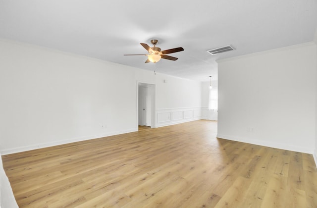 509 Hill St, Moncks Corner, SC 29461 - spare room with ceiling fan, ornamental molding, and light wood-type flooring
