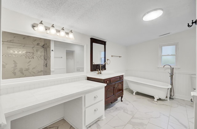 509 Hill St, Moncks Corner, SC 29461 - bathroom with marble look tiles, tiled shower, a freestanding tub, vanity, and wainscoting
