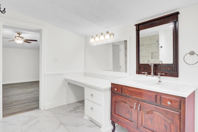 509 Hill St, Moncks Corner, SC 29461 - full bathroom with ceiling fan, marble look tiles, wainscoting, vanity, and a textured ceiling