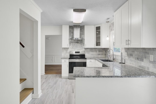509 Hill St, Moncks Corner, SC 29461 - kitchen with wall chimney range hood, electric stove, a sink, light stone counters, and white cabinets