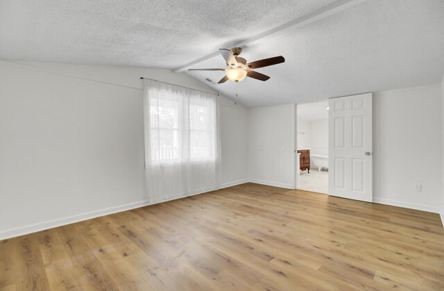 509 Hill St, Moncks Corner, SC 29461 - empty room with a ceiling fan, light wood-style flooring, lofted ceiling, baseboards, and a textured ceiling