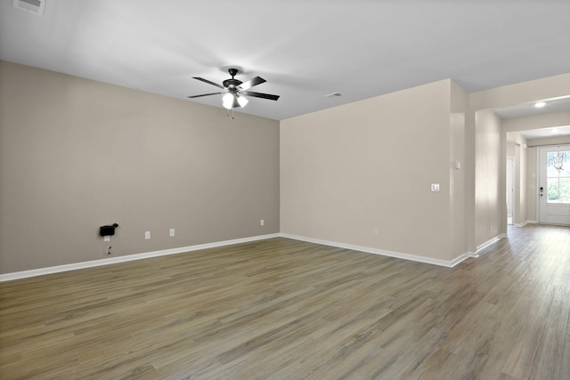 318 Bering Ln, Summerville, SC 29486 - unfurnished room with baseboards, a ceiling fan, wood finished floors, and visible vents