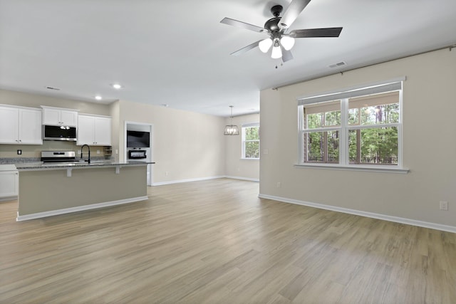 318 Bering Ln, Summerville, SC 29486 - interior space with baseboards, a ceiling fan, light wood-style flooring, and recessed lighting