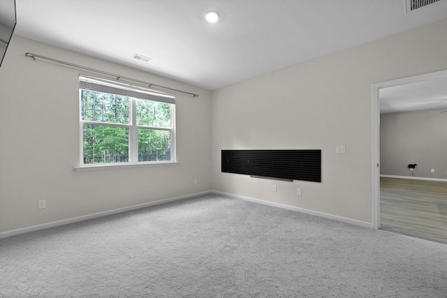 318 Bering Ln, Summerville, SC 29486 - unfurnished living room featuring baseboards, carpet floors, and visible vents