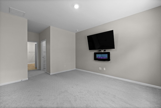 318 Bering Ln, Summerville, SC 29486 - unfurnished living room featuring carpet floors, baseboards, and visible vents