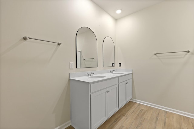 318 Bering Ln, Summerville, SC 29486 - bathroom featuring baseboards, a sink, wood finished floors, and double vanity