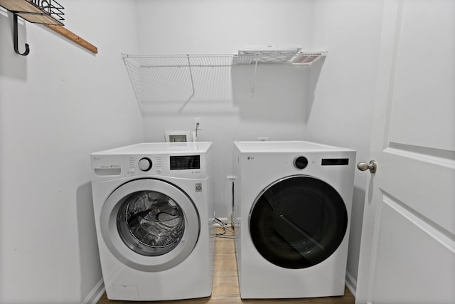 318 Bering Ln, Summerville, SC 29486 - washroom with separate washer and dryer, laundry area, and light wood-style flooring