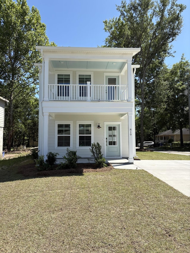 819 Burger St, Charleston, SC 29407 - view of front of home featuring a balcony, a front yard, and driveway