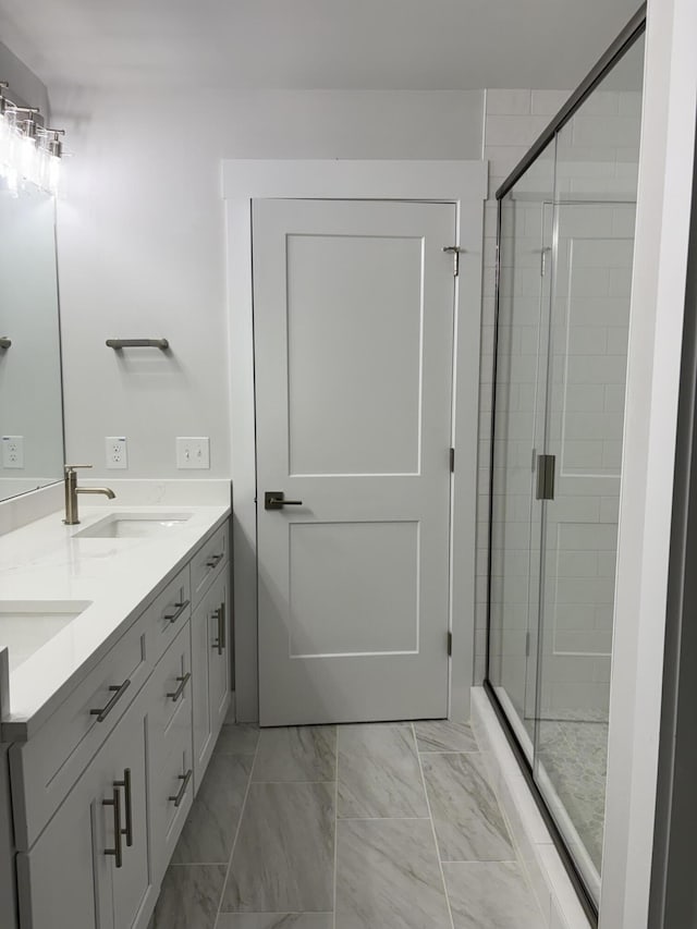 819 Burger St, Charleston, SC 29407 - bathroom with double vanity, a shower stall, and marble finish flooring
