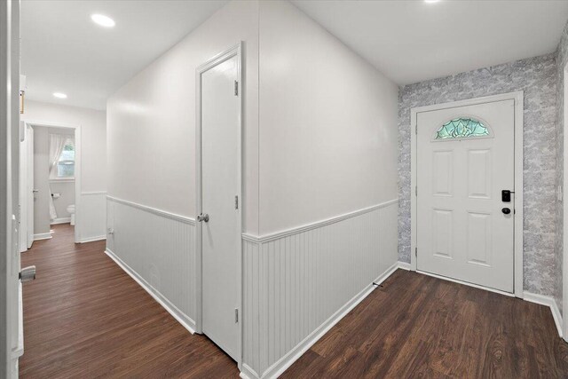 foyer with dark hardwood / wood-style floors