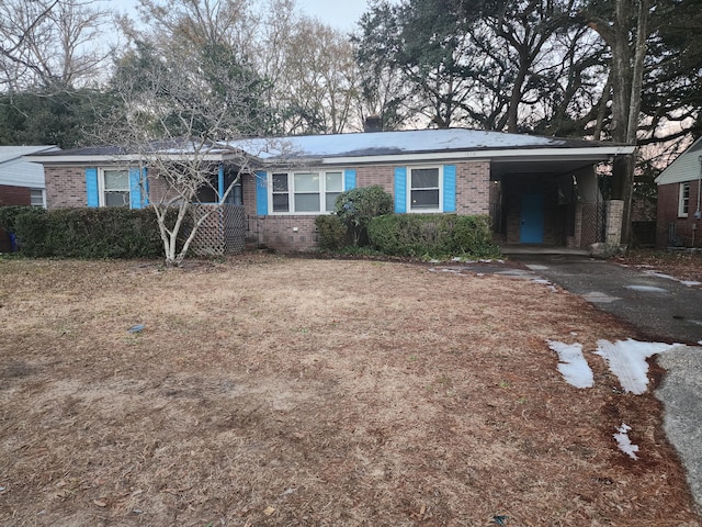 ranch-style house with a carport