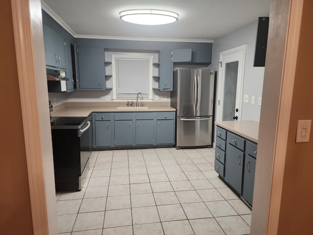 kitchen with sink, crown molding, light tile patterned floors, stainless steel fridge, and black range with electric stovetop