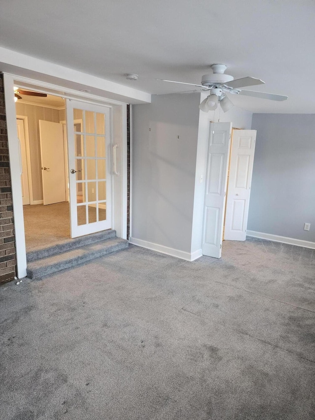 spare room with ceiling fan and carpet flooring