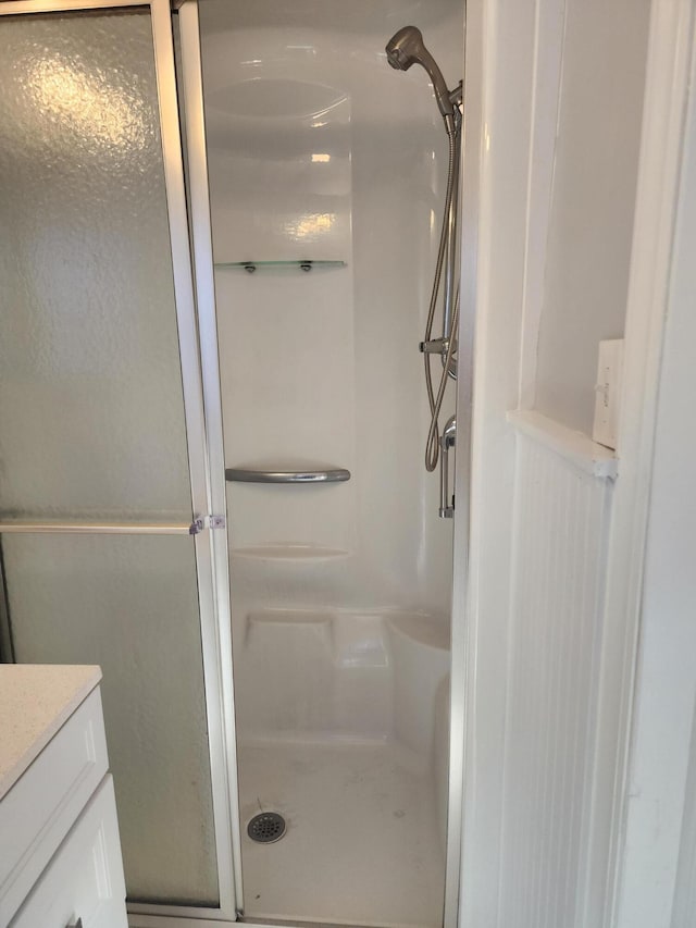 bathroom with vanity and walk in shower