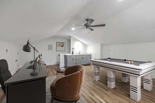 recreation room with lofted ceiling, ceiling fan, light wood finished floors, and visible vents