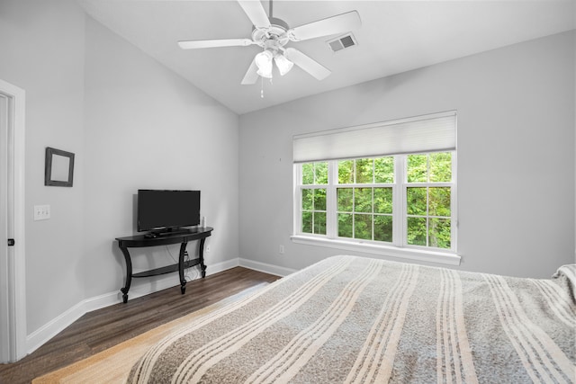 bedroom with wood-type flooring, ceiling fan, and lofted ceiling