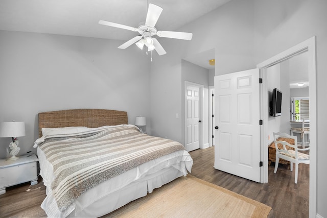 bedroom with hardwood / wood-style floors and ceiling fan