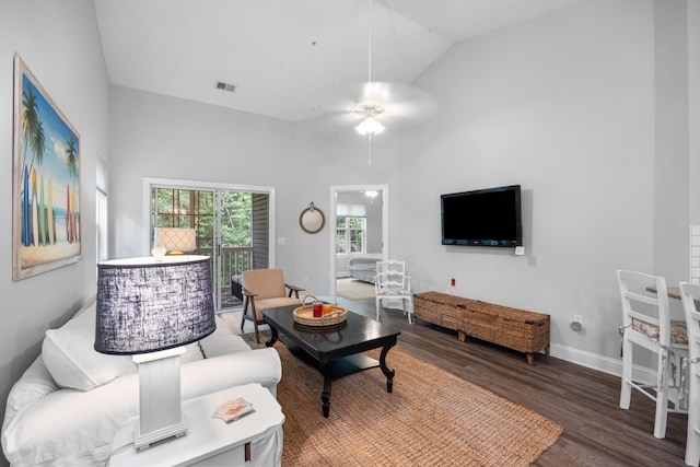 living room with high vaulted ceiling, ceiling fan, and hardwood / wood-style floors