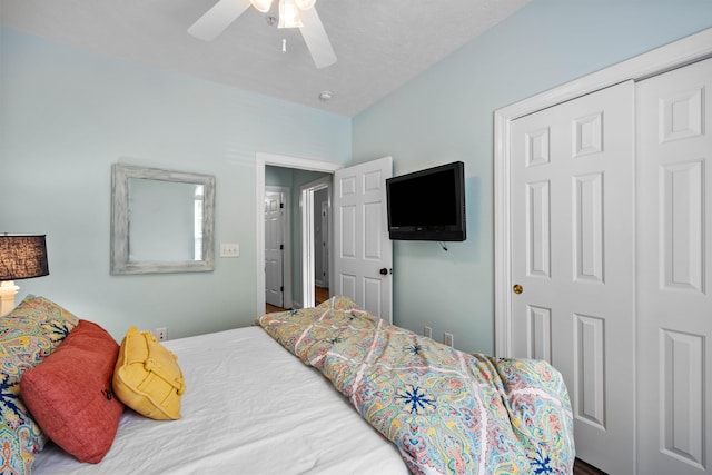 bedroom with a closet, ceiling fan, and hardwood / wood-style floors