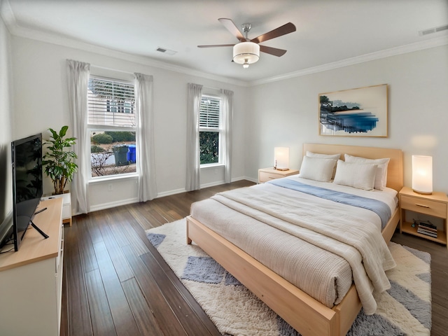 bedroom featuring ceiling fan, dark hardwood / wood-style floors, and ornamental molding