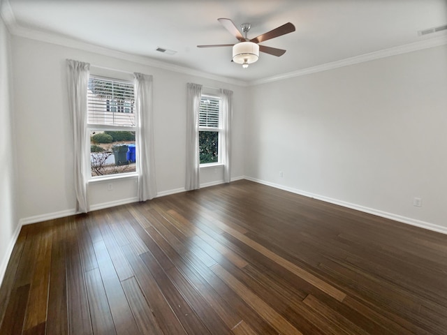 empty room with ceiling fan, ornamental molding, and dark hardwood / wood-style floors