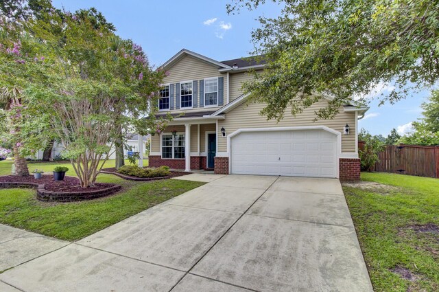 view of front facade with a garage and a front lawn