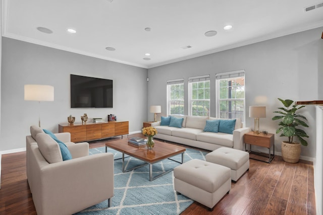 living room with dark wood-type flooring and ornamental molding