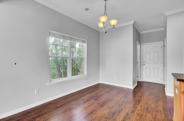 empty room with a notable chandelier, dark hardwood / wood-style flooring, and crown molding