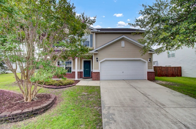 view of front of house featuring a garage and a front yard