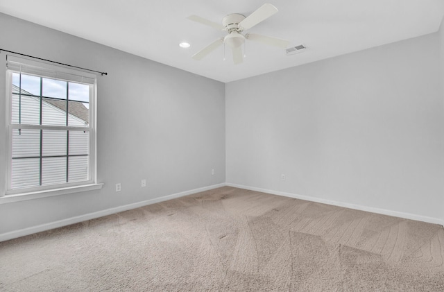 unfurnished room featuring carpet flooring and ceiling fan