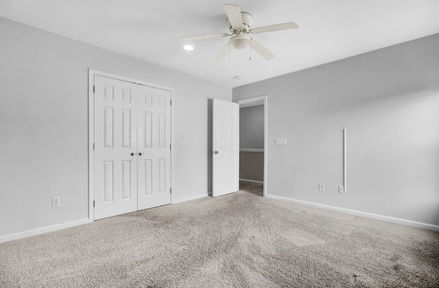 unfurnished bedroom featuring a closet, carpet, and ceiling fan