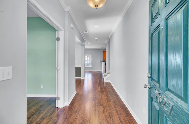 foyer with dark hardwood / wood-style flooring and crown molding