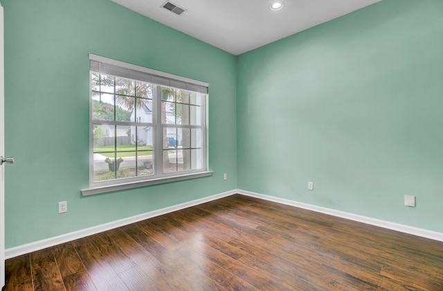 empty room with dark wood-type flooring