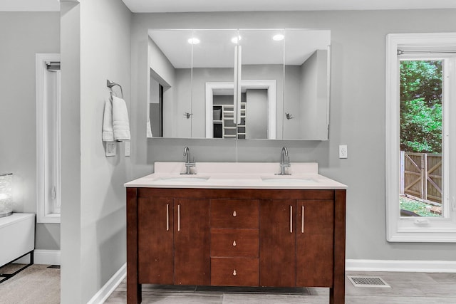 8 Pony Ln, Charleston, SC 29407 - bathroom featuring double vanity and baseboards