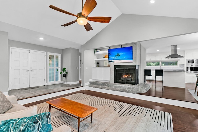 8 Pony Ln, Charleston, SC 29407 - living area with a warm lit fireplace, ceiling fan, high vaulted ceiling, recessed lighting, and wood finished floors