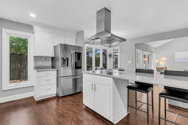 8 Pony Ln, Charleston, SC 29407 - kitchen with stainless steel fridge, island exhaust hood, a kitchen breakfast bar, dark wood finished floors, and recessed lighting