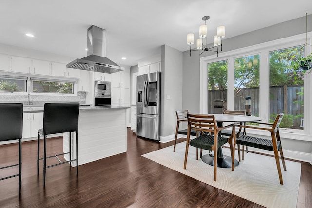 8 Pony Ln, Charleston, SC 29407 - kitchen featuring ventilation hood, stainless steel appliances, white cabinets, dark wood finished floors, and a chandelier