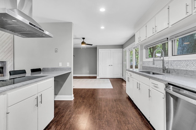 8 Pony Ln, Charleston, SC 29407 - kitchen with stainless steel dishwasher, wall chimney range hood, a sink, recessed lighting, and light countertops
