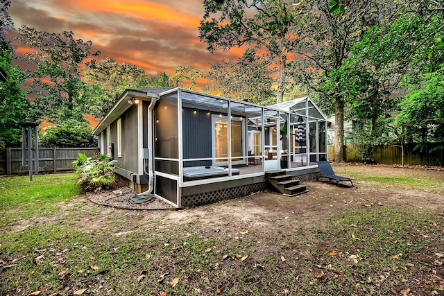 8 Pony Ln, Charleston, SC 29407 - back of property at dusk with a deck