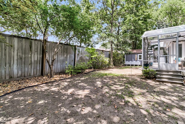 8 Pony Ln, Charleston, SC 29407 - fenced backyard featuring a trampoline and a sunroom