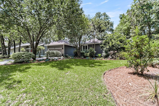 8 Pony Ln, Charleston, SC 29407 - view of green lawn with an attached garage